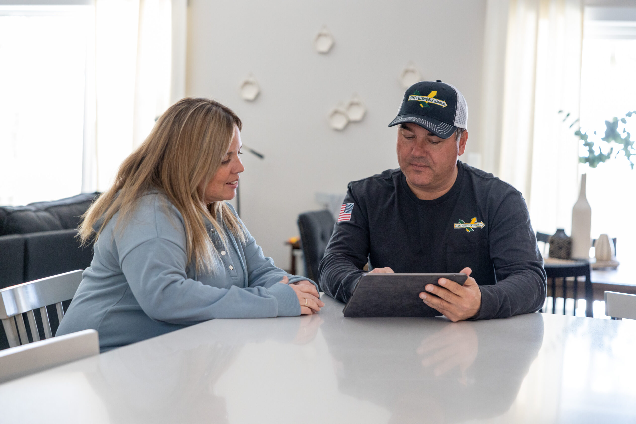 Verne & Ellsworth Hann team member speaking with a homeowner after completing a service