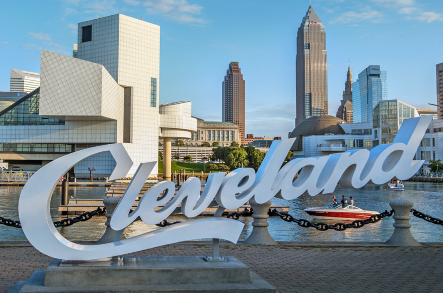 large Cleveland sculpture sign in front of the cityscape